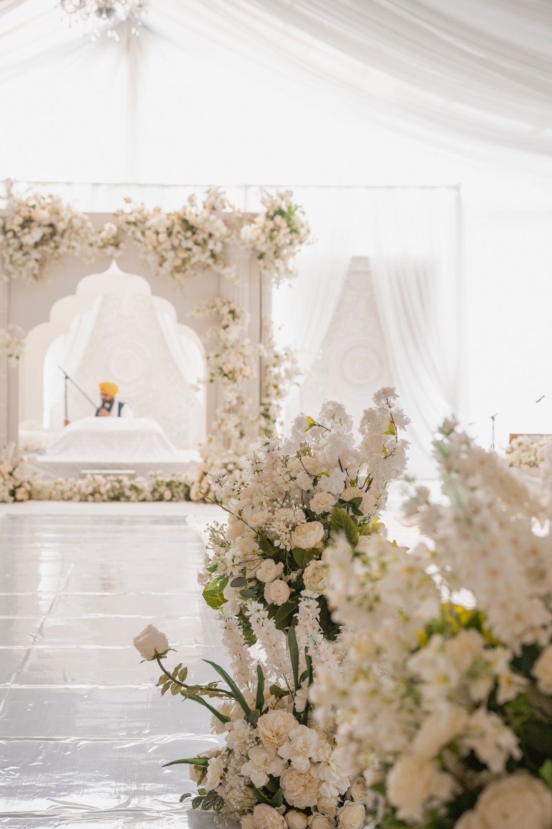 White floral ceremony stage by GPS Decors
