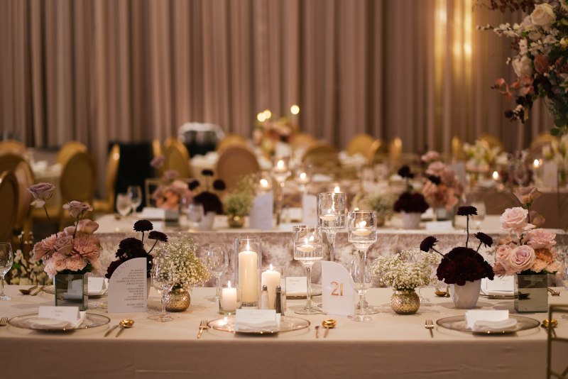 Gold chairs and soft floral centrepieces by GPS Decors