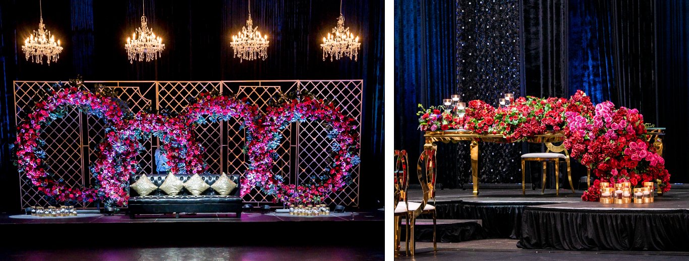 Stage with fuchsia and purple floral rings over a lattice backdrop and crystal chandeliers, beside a red rose head table, by GPS Decors