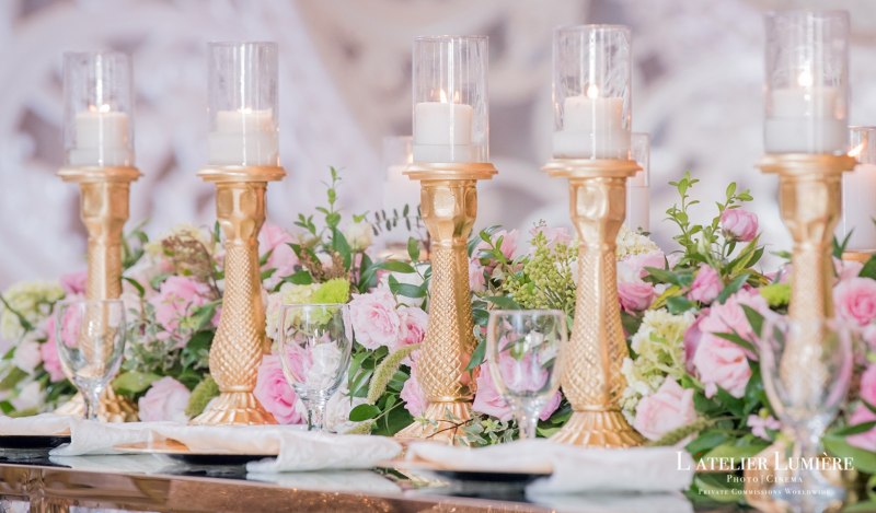 Gold candle stand centrepiece with soft florals by GPS Decors