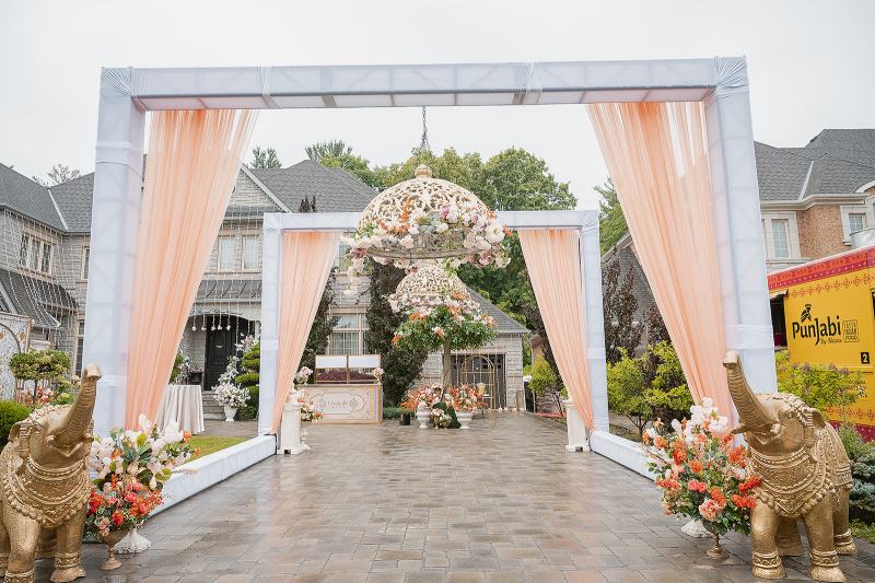 Outdoor jaago entrance with peach draped frames by GPS Decors