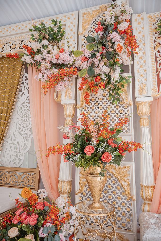 Jaago decor detail with white lattice, peach draping and florals by GPS Decors
