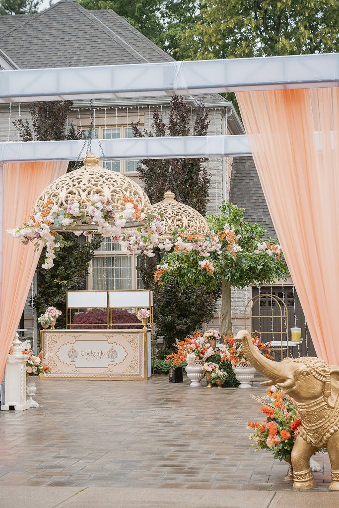 Jaago lounge with filigree lanterns and peach draping by GPS Decors