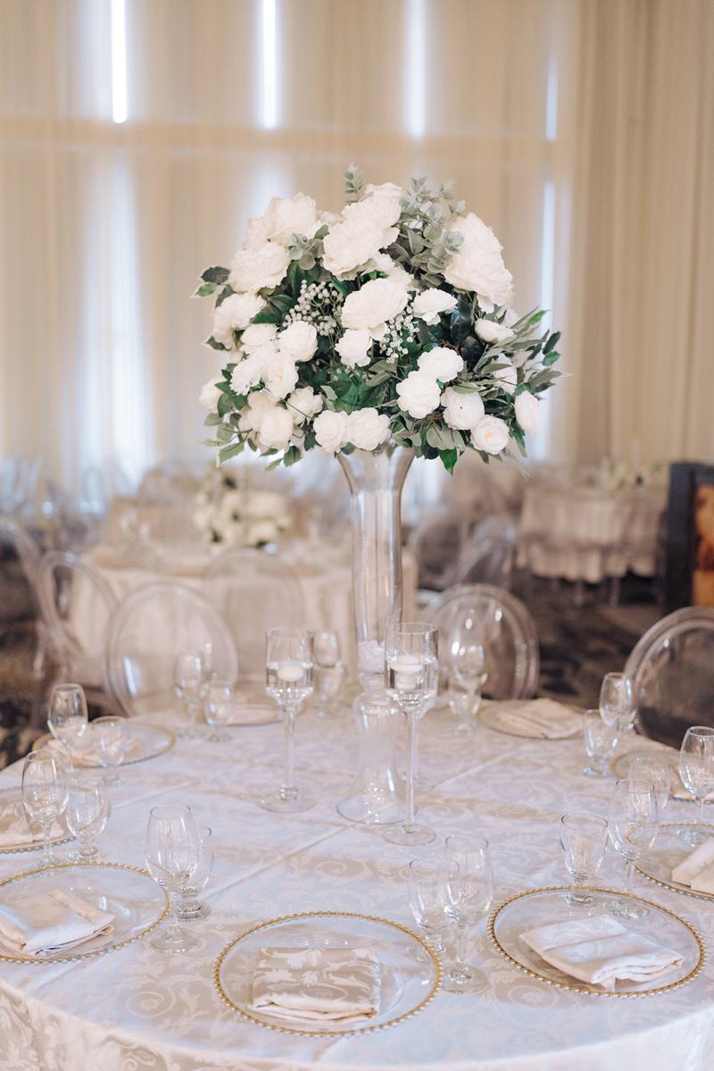 White rose and hydrangea centrepiece on a reception table by GPS Decors