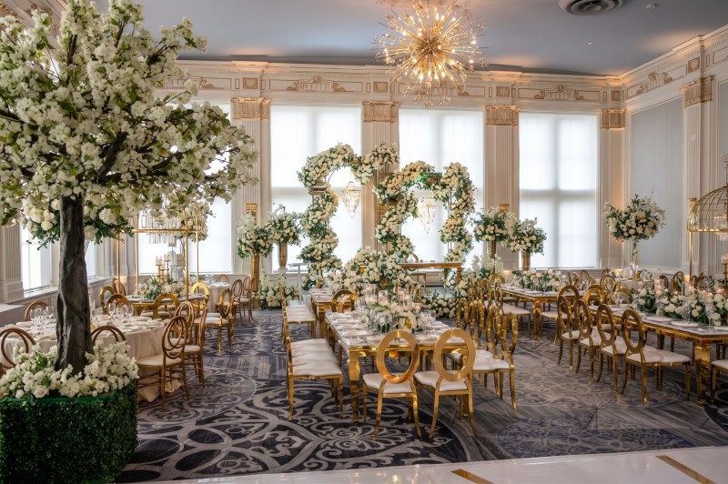 Reception at the King Edward Hotel in Toronto with white blossom trees and floral hoops by GPS Decors