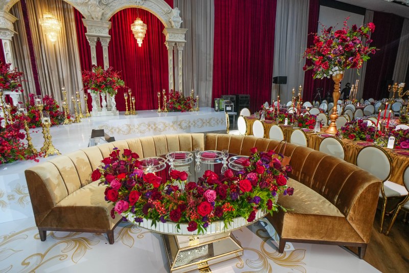 Sweetheart table with mirrored base and red roses by GPS Decors