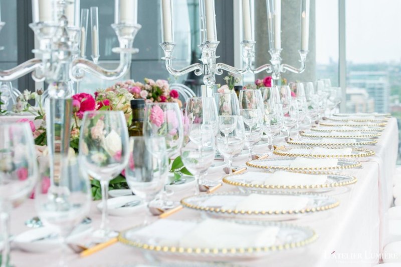Elegant event table with crystal glassware and a candelabra by GPS Decors