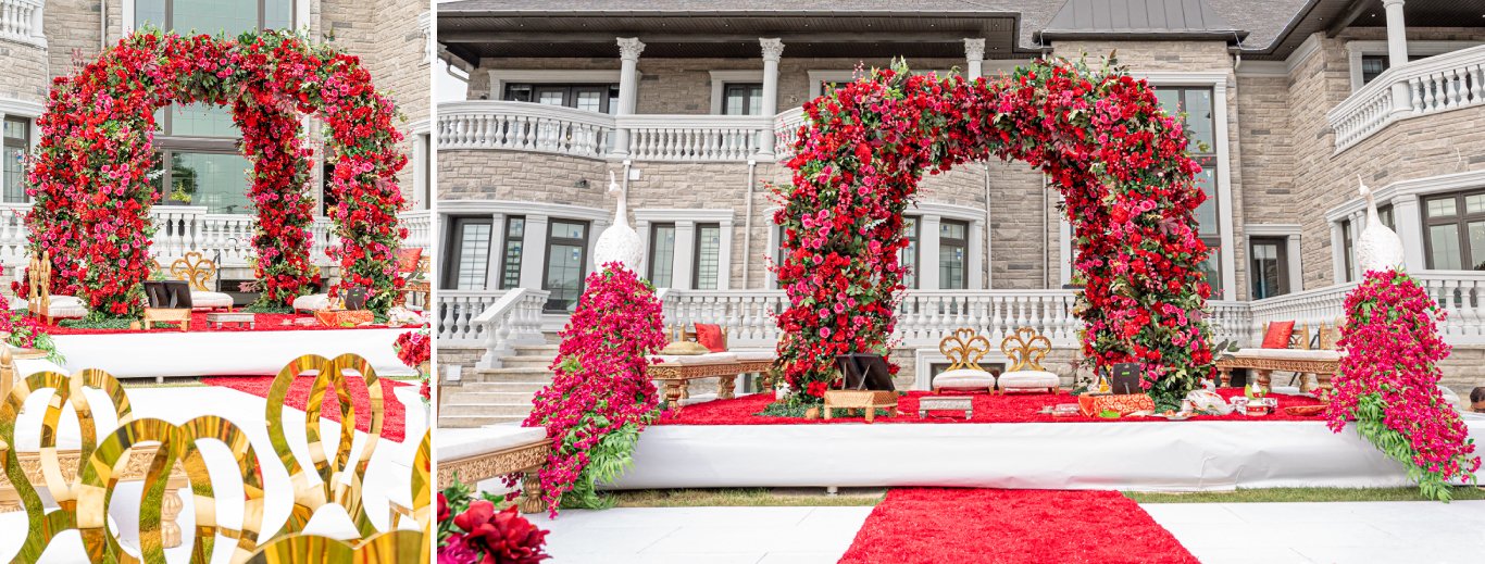 Outdoor mandap of red rose arches with a red carpet in front of a stone estate by GPS Decors