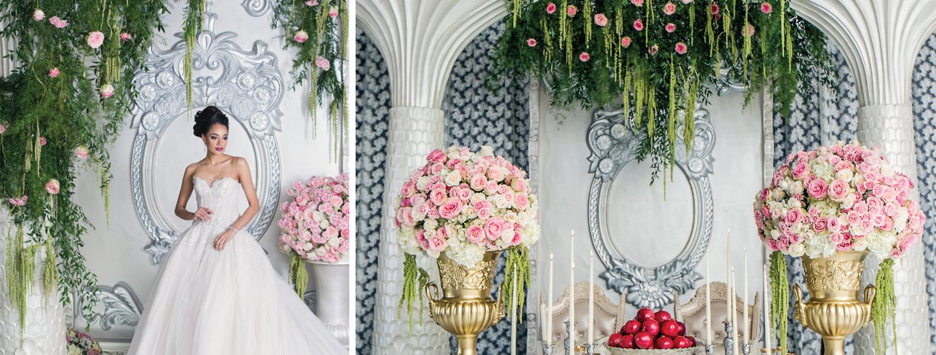 Bride before a white arched backdrop with hanging greenery and gold urns of pink roses by GPS Decors