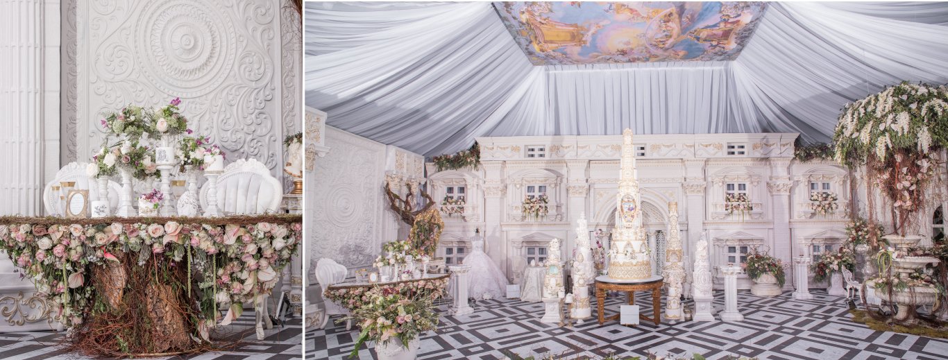 White carved stage with a tiered wedding cake, draped ceiling and a floral tree-trunk sweetheart table by GPS Decors